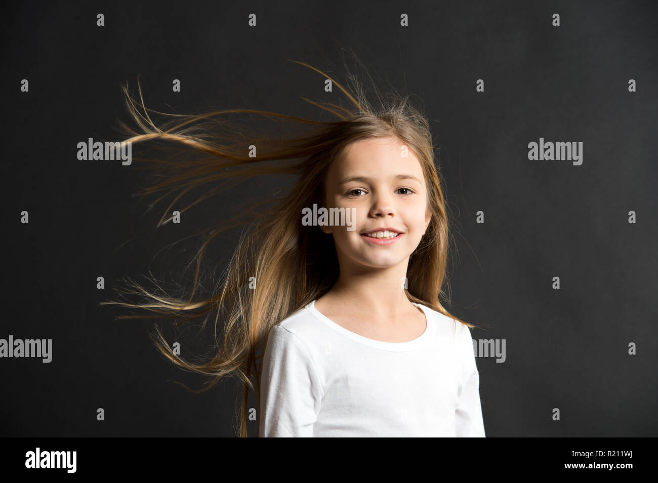 Natural Beauty Girl Kid Long Hair Flying In Air Black Background