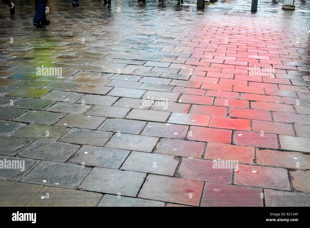 Wet pavement colourful reflections, Northumberland Street Newcastle Stock Photo