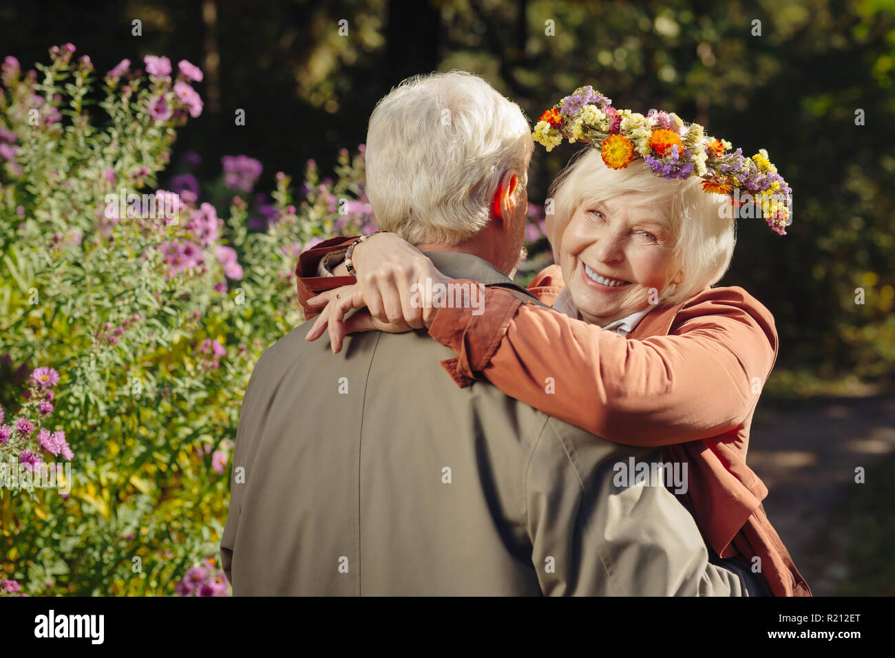 Positive happy woman hugging her beloved husband Stock Photo - Alamy