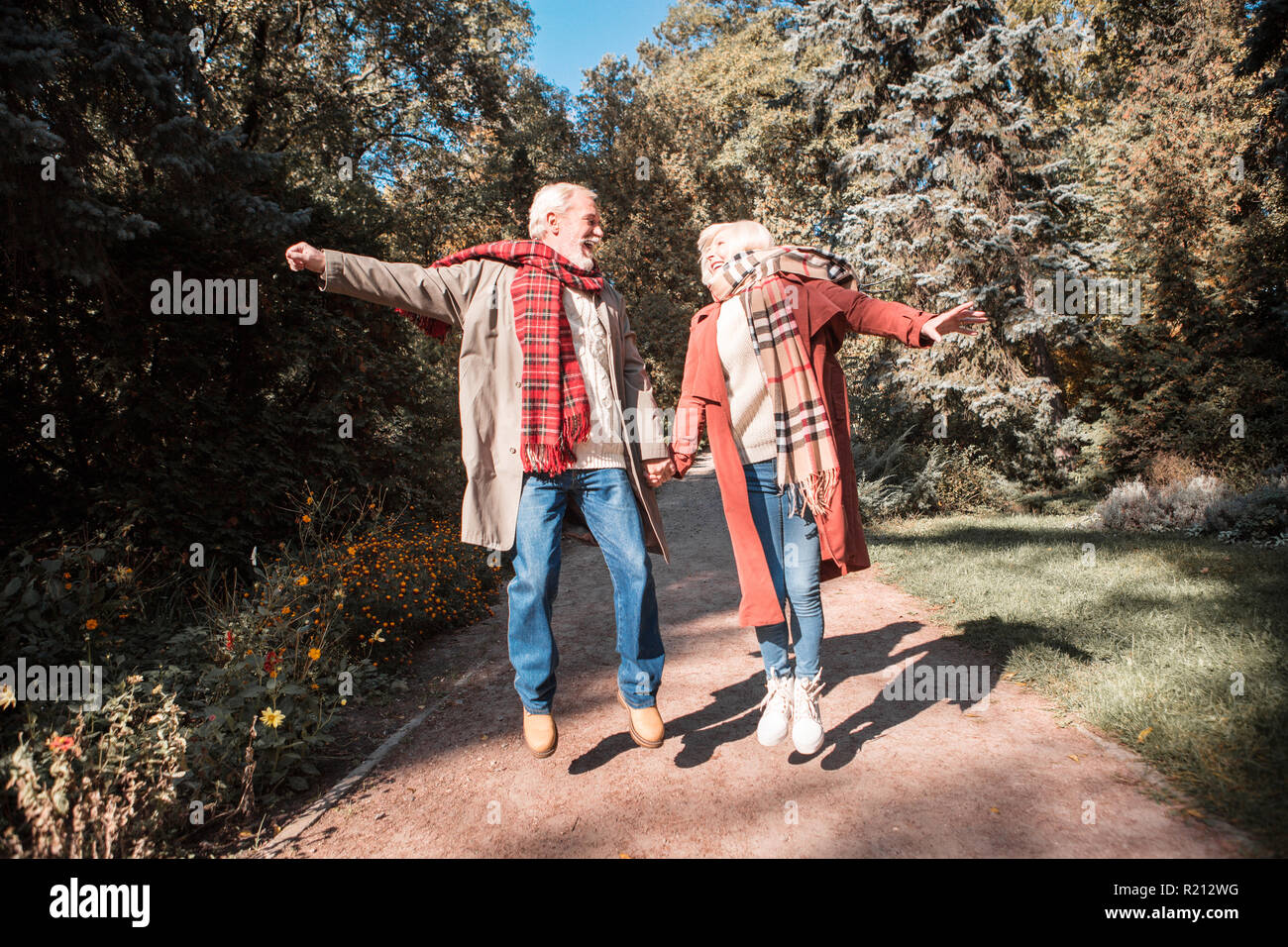 Joyful happy friends having a great walk together Stock Photo