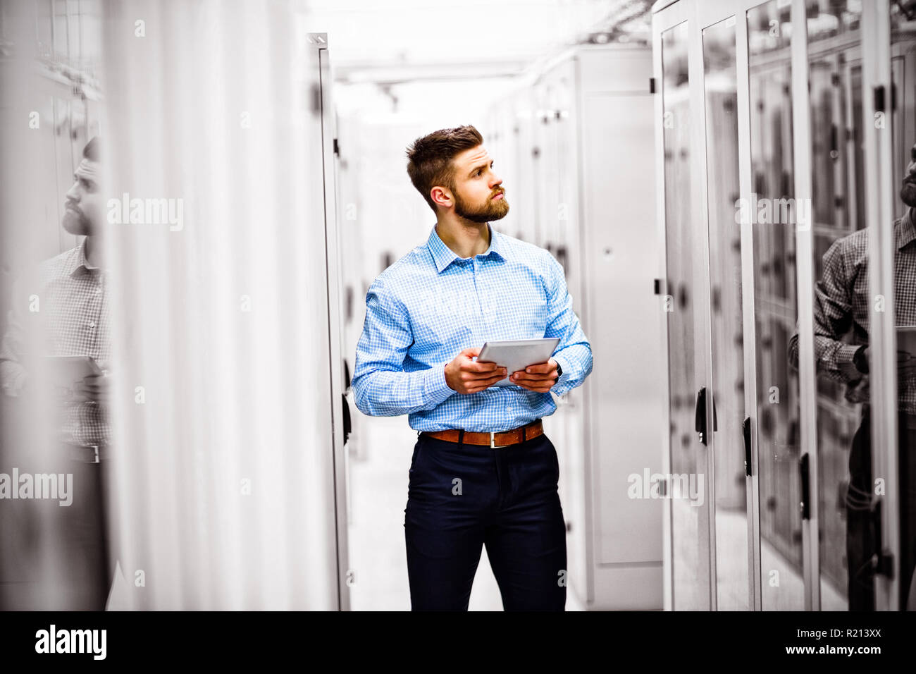 Technician using digital tablet Stock Photo