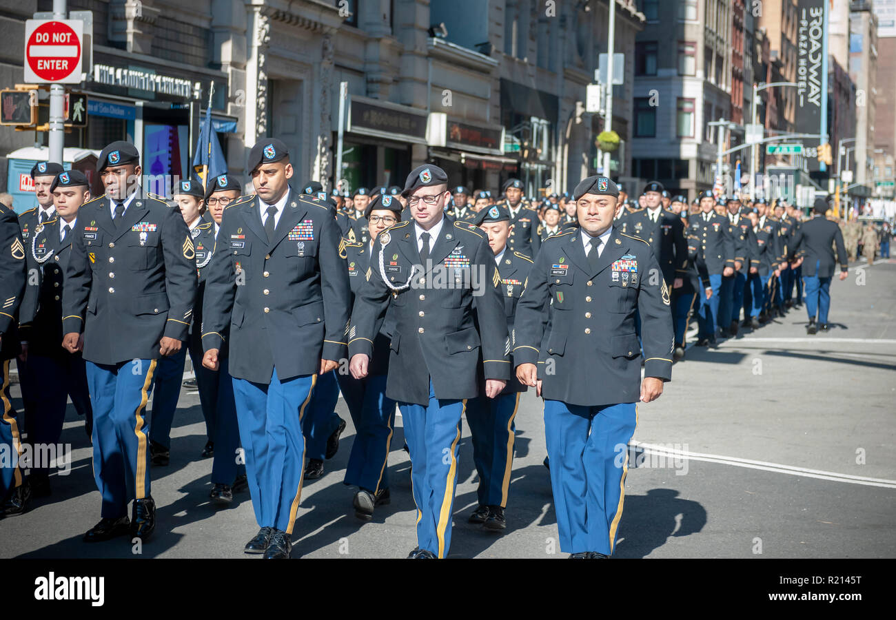 Marchers on Fifth Avenue in New York for the Veterans Day Parade on Sunday, November 11, 2018.  Originally knows as Armistice Day, this year the holiday commemorates the 100th anniversary of the end of World War I. On the eleventh hour of the eleventh day of the eleventh month the guns fell silent in 1918 marking the end of World War I.  The holiday has been expanded to include all American soldiers from all wars. (Â© Richard B. Levine) Stock Photo