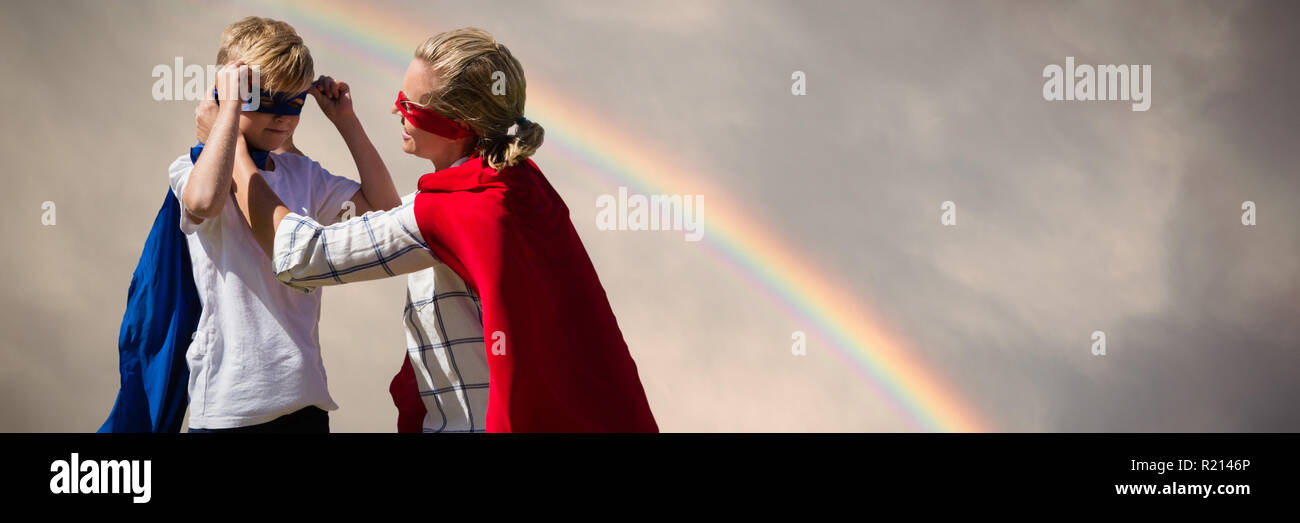 Composite image of mother and son pretending to be superhero Stock Photo