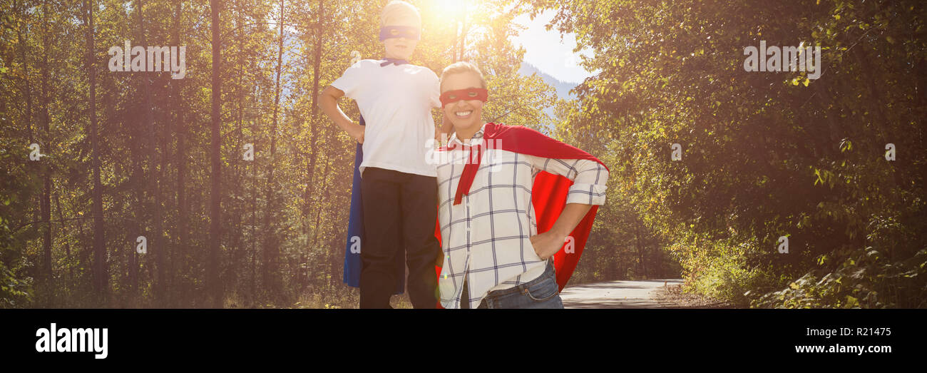 Composite image of mother and son pretending to be superhero Stock Photo