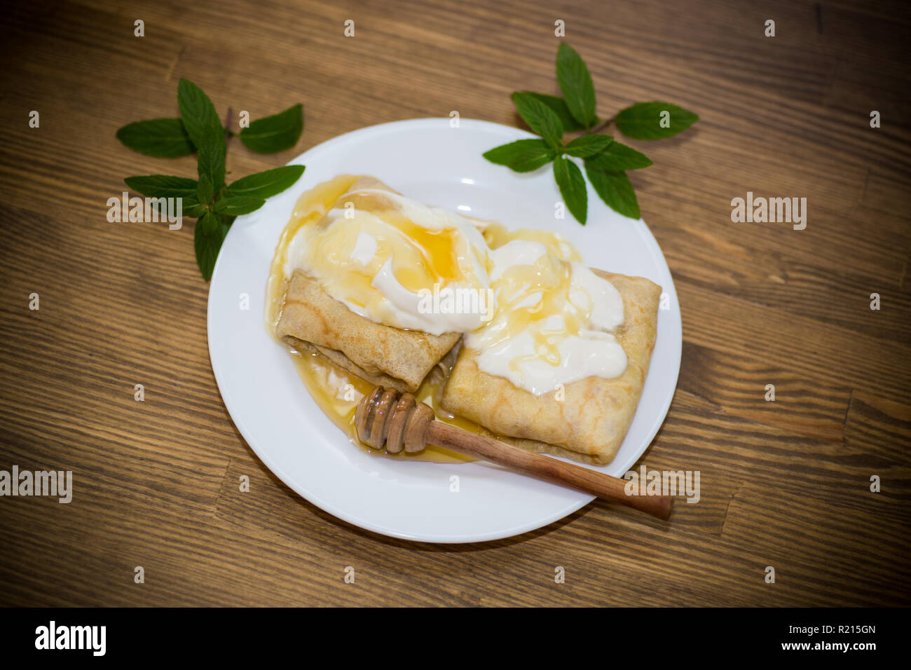 Sweet Pancakes With Cottage Cheese Sour Cream And Honey In A