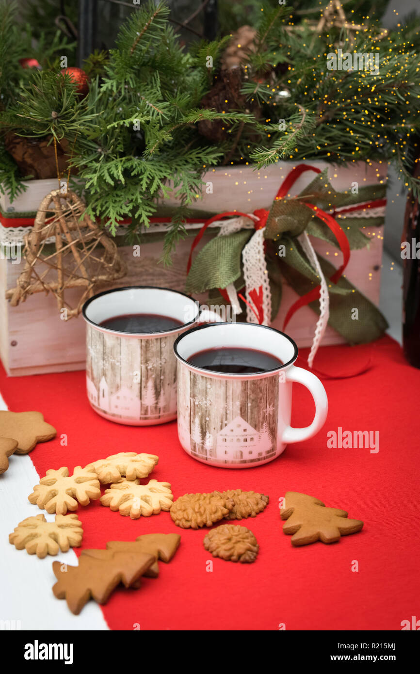 Mulled Wine In White Ceramic Mugs With Christmas Biscuits On The