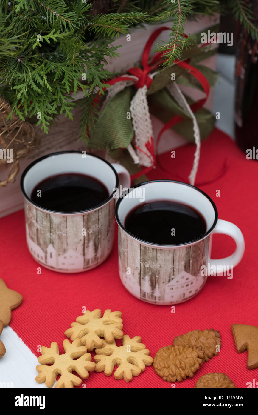 Mulled Wine In White Ceramic Mugs With Christmas Biscuits On The