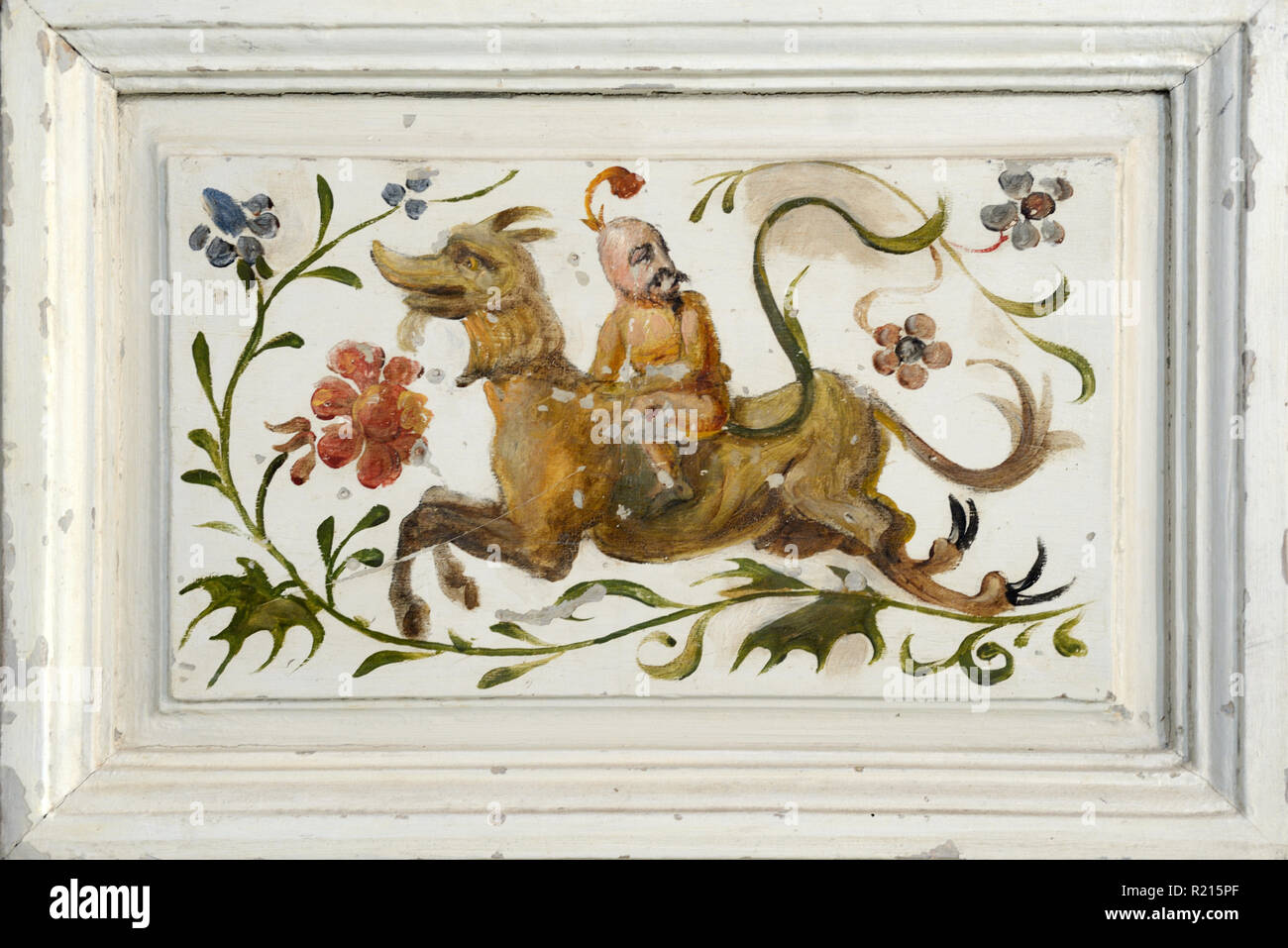 Strange Surreal Rider Riding Mythical Horse-like Creature on Interior Painted Doors or Cupboard Door Provence France c19th Stock Photo