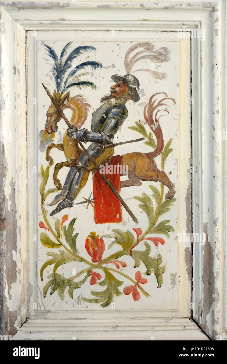 Strange Surreal Rider, Knight in Armour, or Don Quixote Riding Mythical Horse-like Creature on Interior Painted Door or Cupboard Provence France c19th Stock Photo