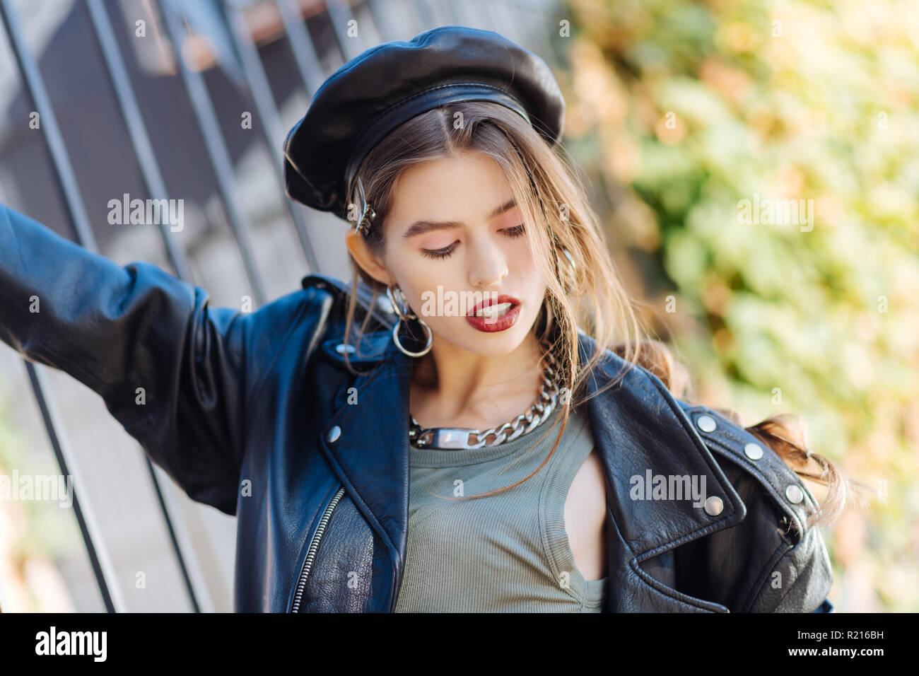Beautiful dark-haired young model with nice makeup wearing accessories Stock Photo