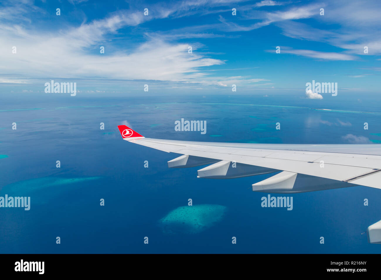 10.12.2016 - Maldives, Male: Turkish Airlines Being 777 landing in Maldives capital city and airport, blue sea and island view from plane Stock Photo