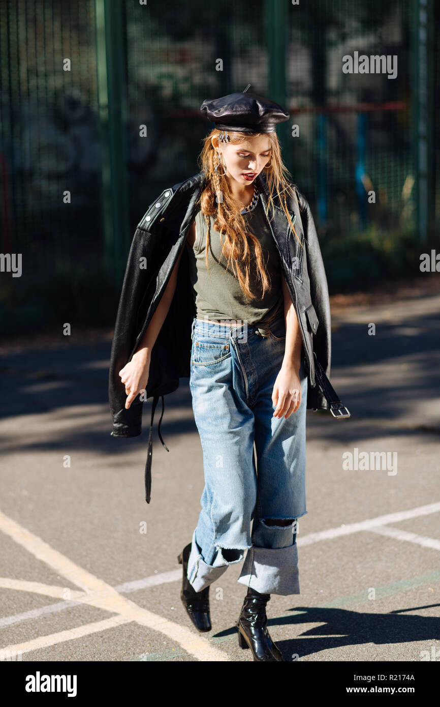 Appealing fashion model enjoying the sunshine while posing outside Stock Photo