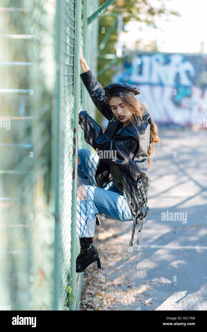 Fashion model wearing three hair slides and massive earrings Stock Photo