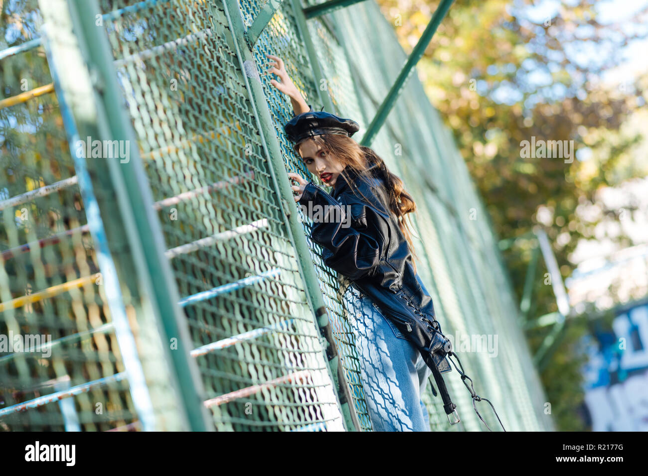 Appealing top model posing outside promoting autumn collection Stock Photo