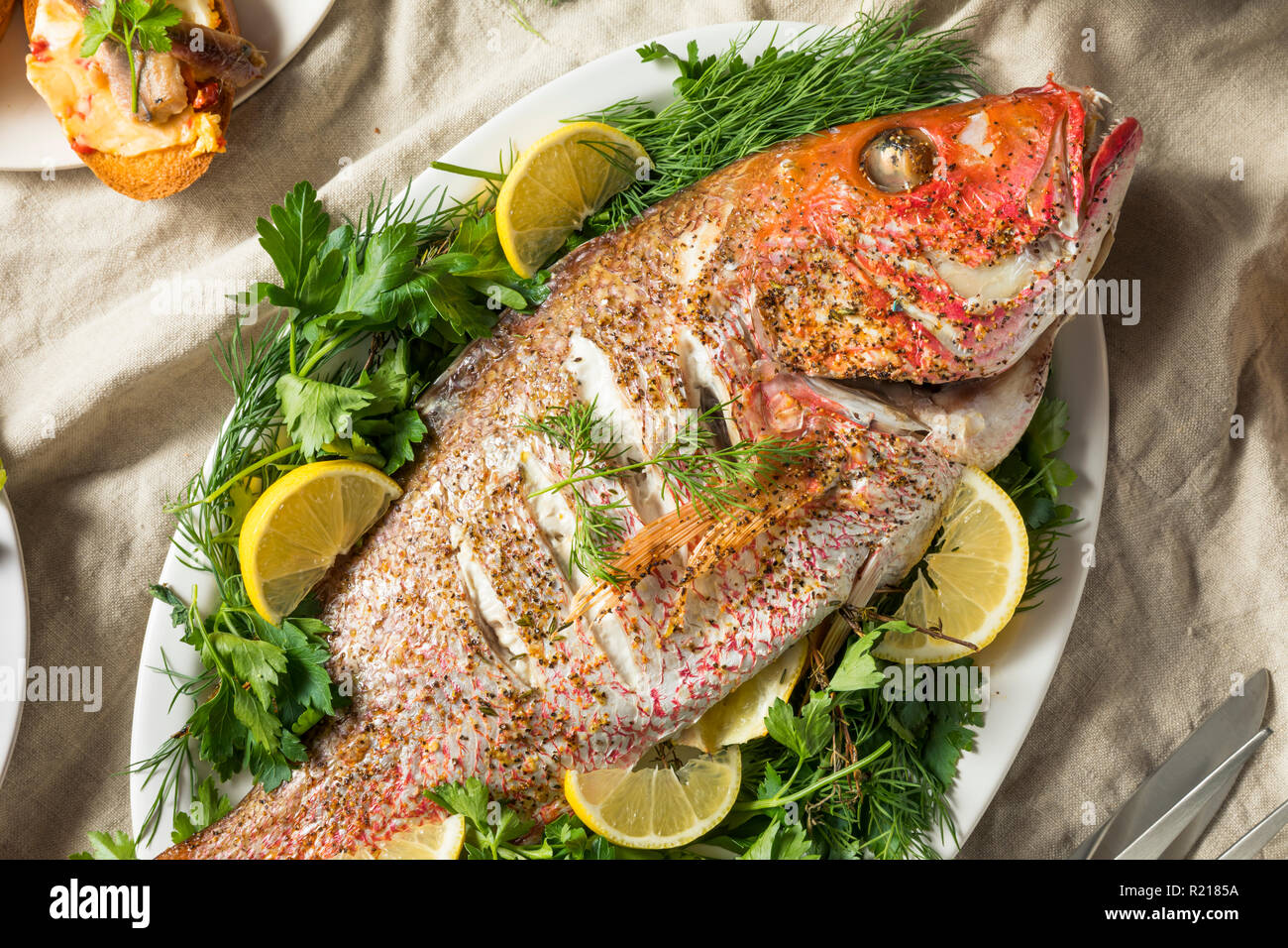 Holiday Italian Feast of 7 Fishes with Snapper Octopus and Pasta Stock Photo