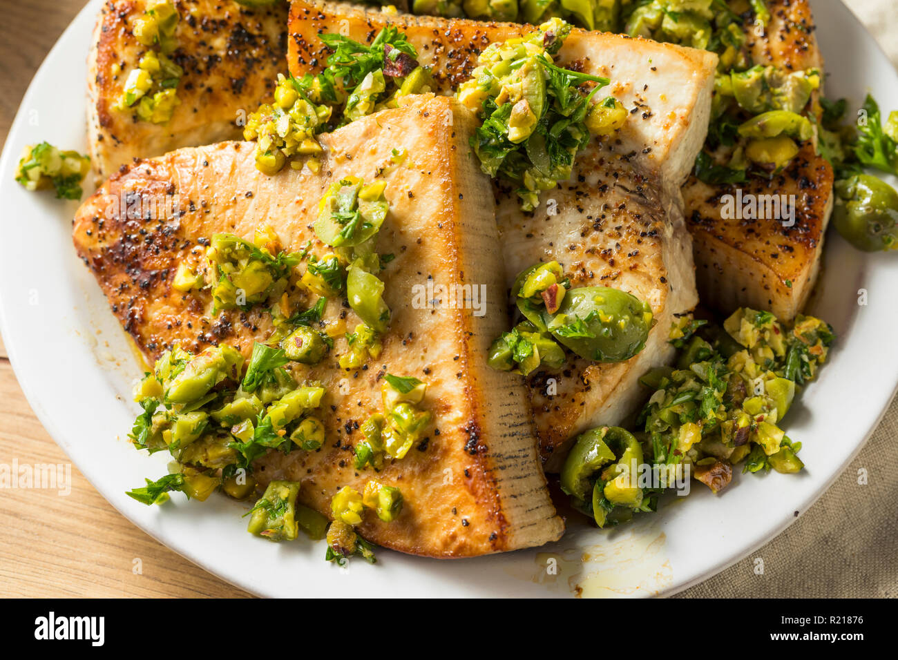 Homemade Grilled Swordfish Steaks with Olive Topping Stock Photo Alamy