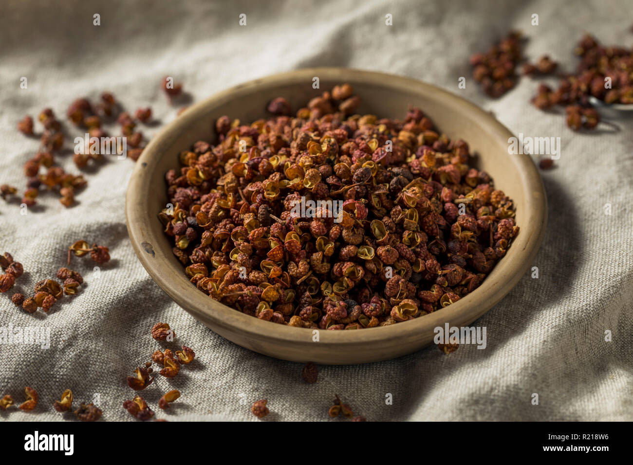 Raw Organic Dry Szechuan Peppercorns in a Bowl Stock Photo