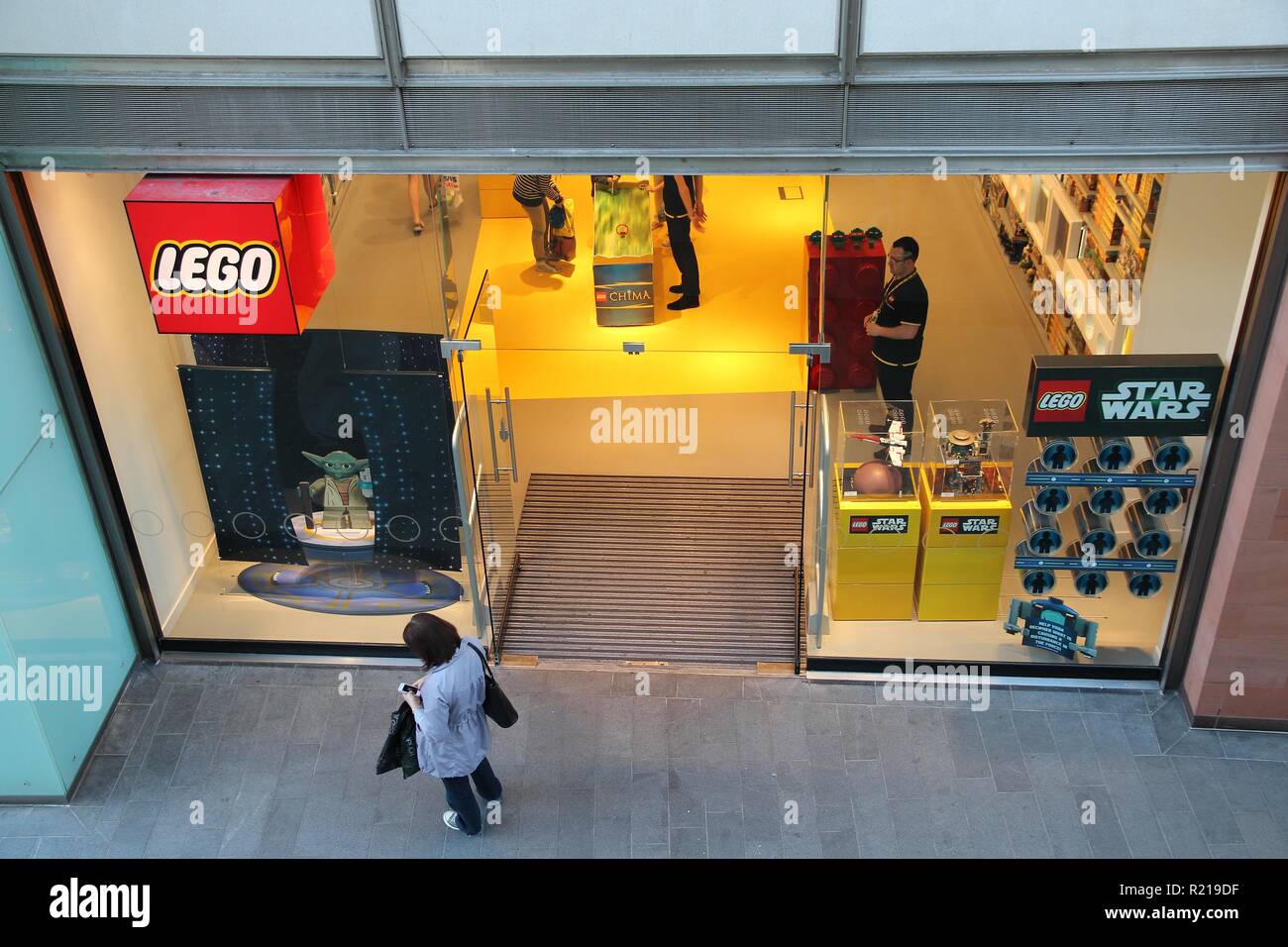 LIVERPOOL, UK - APRIL 20, 2013: People shop at Lego store in Liverpool, UK. Lego Group had 4.7 billion USD revenue in 2013 (with 1.5 billion USD incom Stock Photo