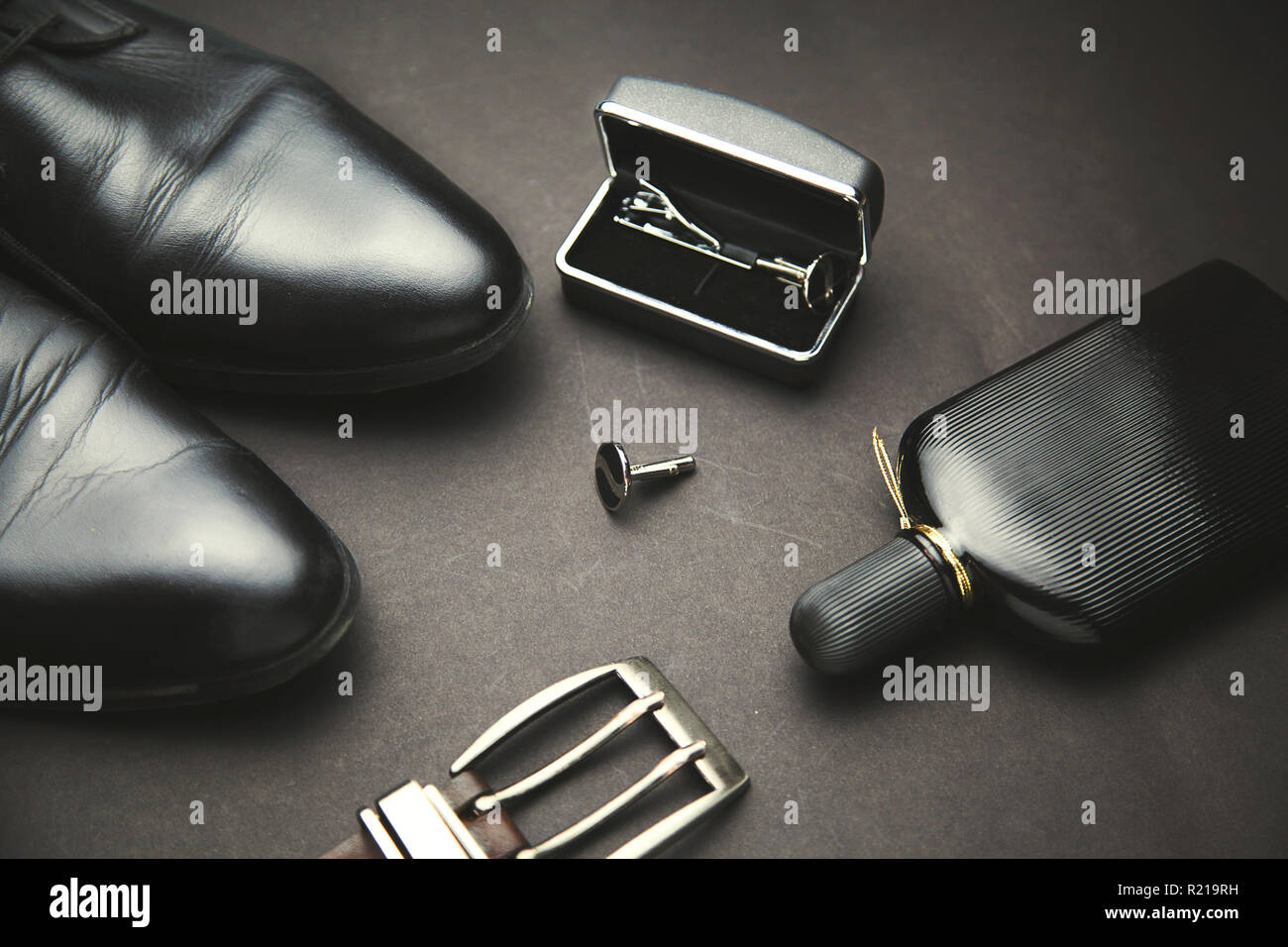 shoes belts perfume on the black accessory Stock Photo Alamy