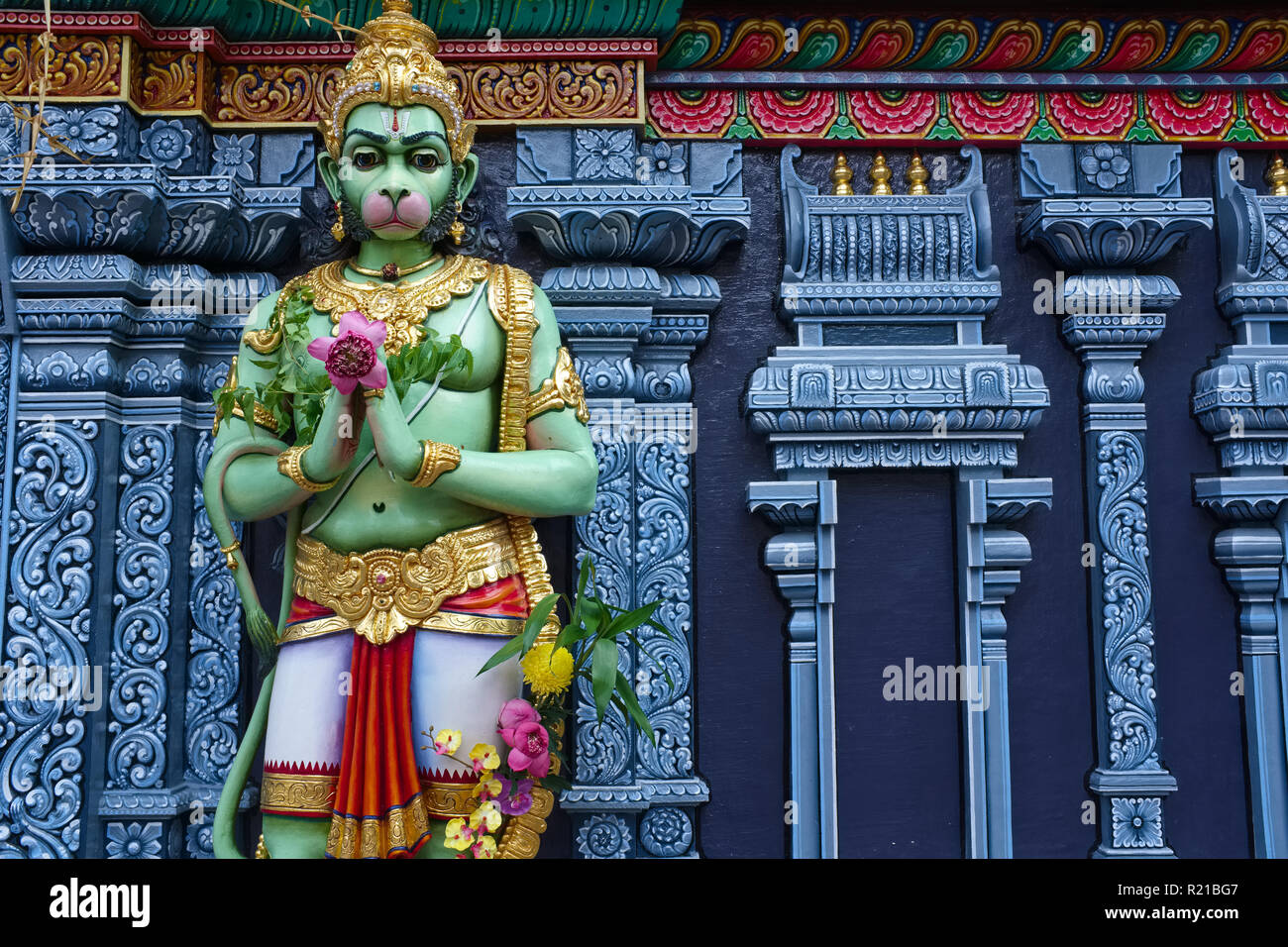A statue of Hindu monkey god Hanuman greeting visitors with the gesture