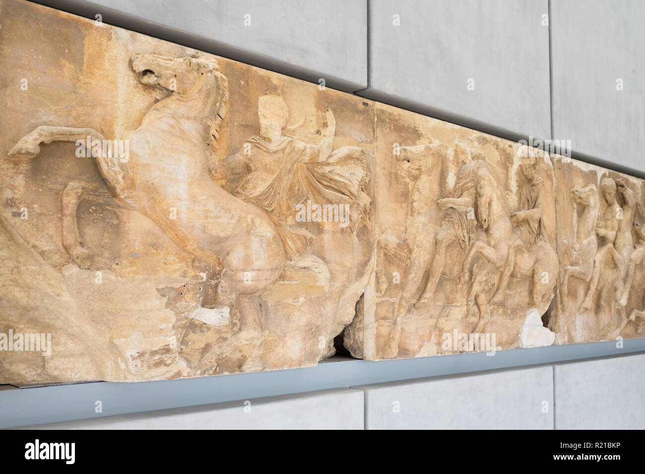 The frieze of the Parthenon, depicting the panathenaic procession, as seen in the Acropolis Museum, Athens, Greece. Stock Photo