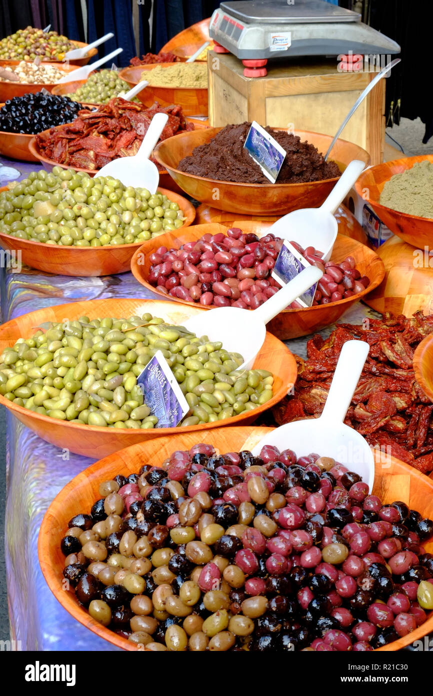St-Cyprien, Dordogne, France - 24th September 2015: Colourful olives, dried tomatoes and lemons displayed during the Sunday street market in St-Cyprien, Dordogne, France Stock Photo