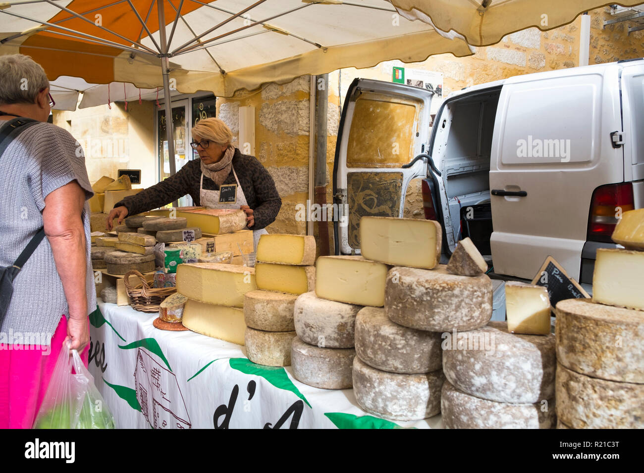St-Cyprien, Dordogne, France - 24th September 2015: Cheese stall at the Sunday street market in St-Cyprien, Dordogne, France Stock Photo