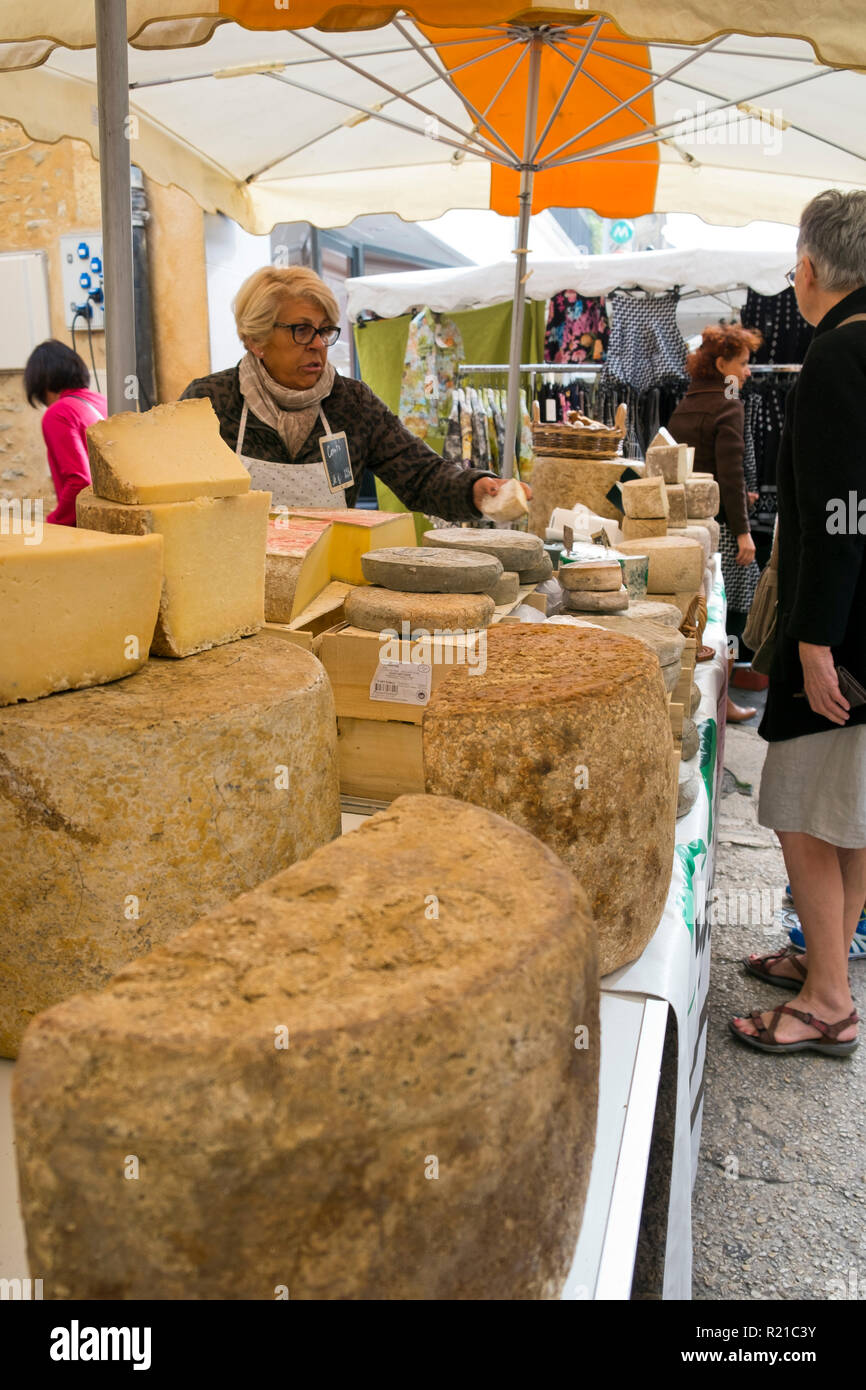 St-Cyprien, Dordogne, France - 24th September 2015: Cheese stall at the Sunday street market in St-Cyprien, Dordogne, France Stock Photo