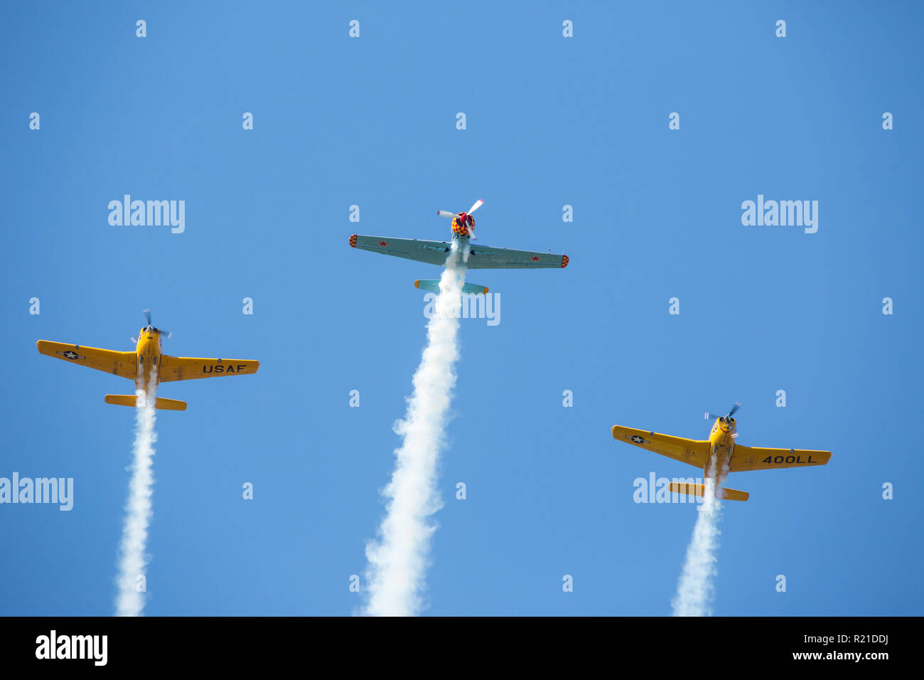 MONROE, NC (USA) - November 10, 2018: Three aerobatic aircraft flying in formation at the Warbirds Over Monroe Air Show. Stock Photo