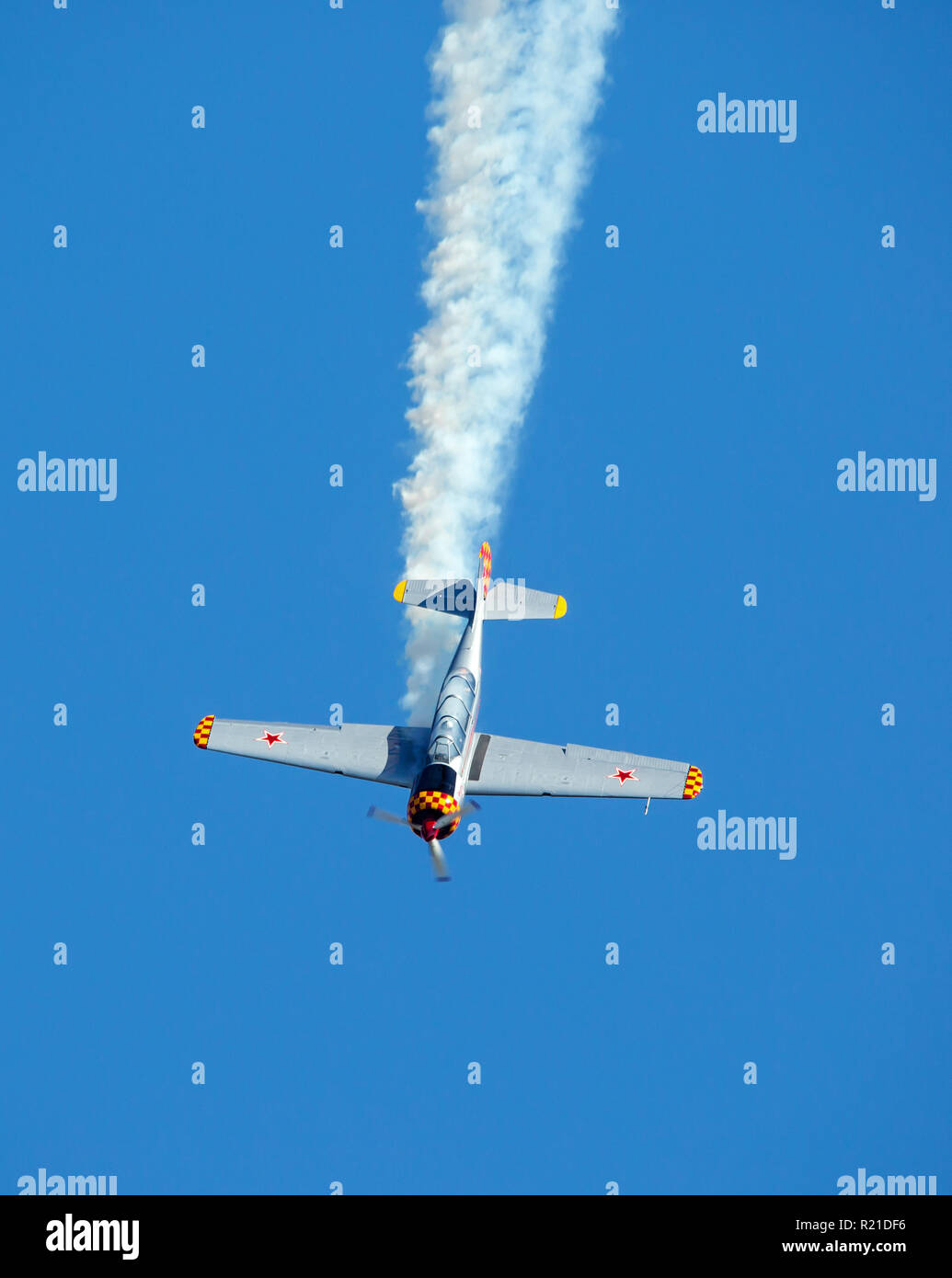 MONROE, NC (USA) - November 10, 2018: An aerobatic aircraft performs a dive in deep blue sky at the Warbirds Over Monroe Air Show. Stock Photo