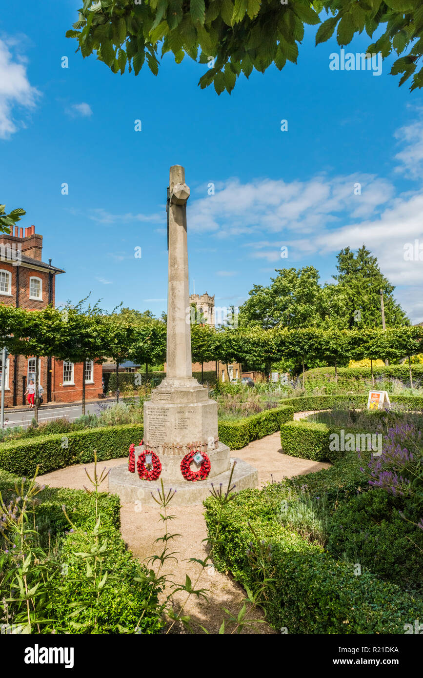 The village war memorial in Woburn, Bedfordshire, England. The memorial stands in a small garden not far from Woburn Abbey Stock Photo