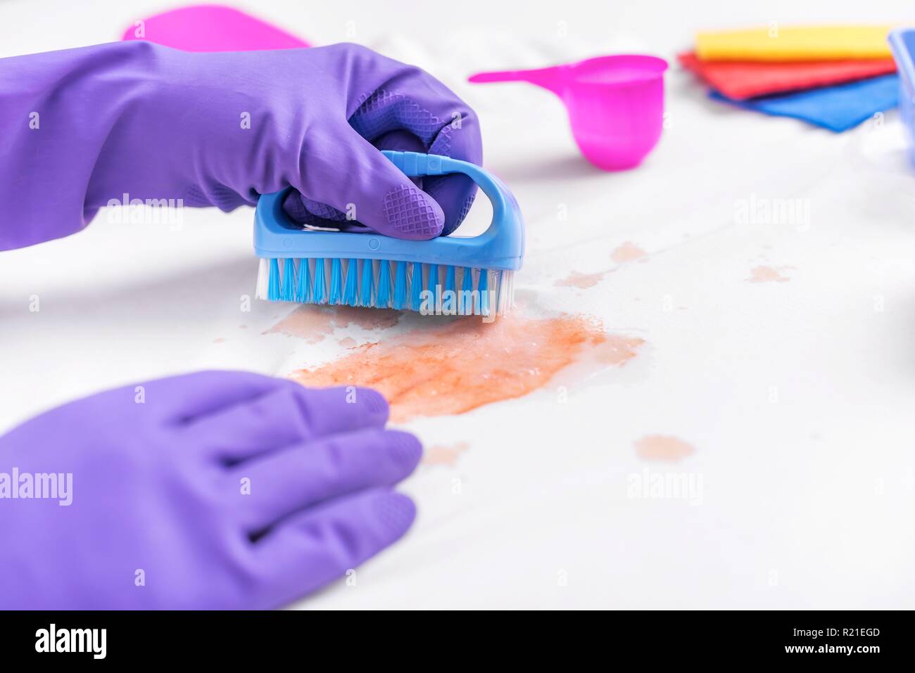 Clean the stain on clothes with a special brush Stock Photo - Alamy