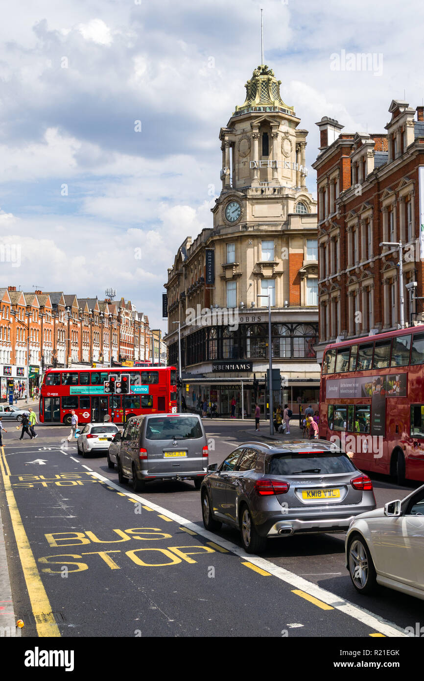 View of St. John's Hill with vehicles, buildings and people on a sunny Summer day, Clapham Junction , Wandsworth, London, UK Stock Photo