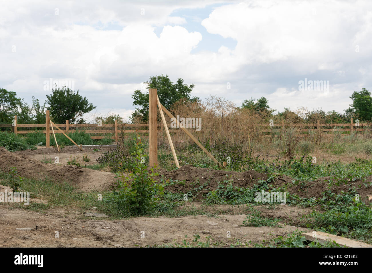 Support fence. Construction of a wooden rural fence. Stock Photo