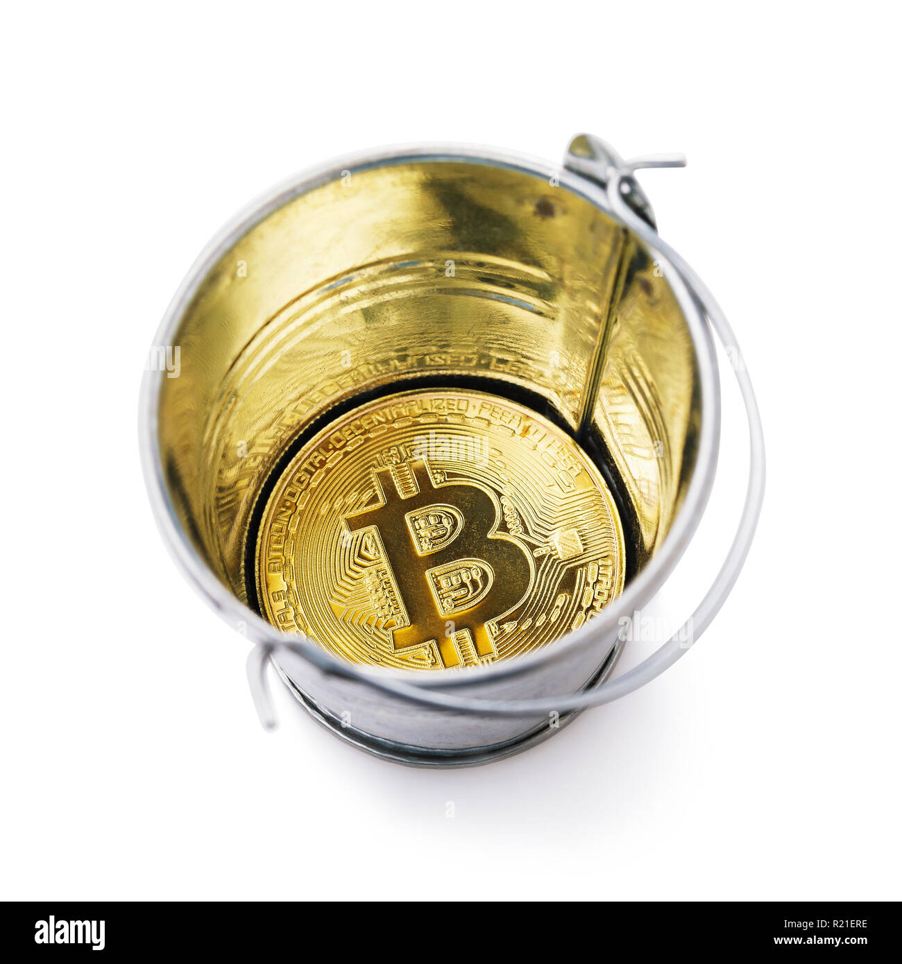 Bitcoin at the bottom of a bucket isolated on white background ...