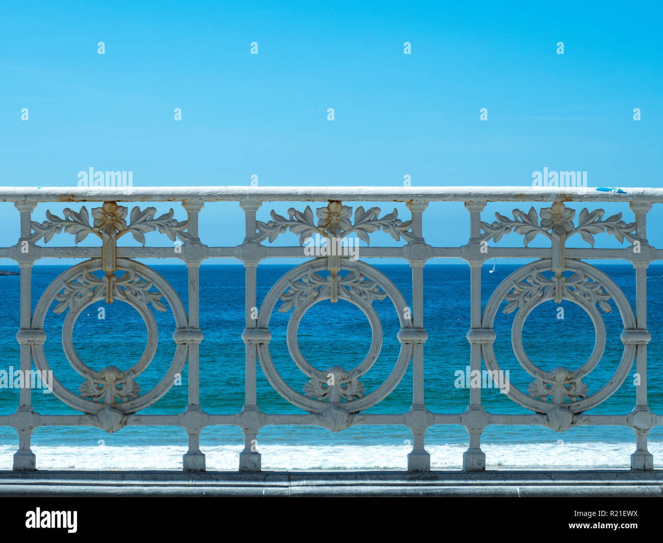white railing facing the blue sea Stock Photo - Alamy