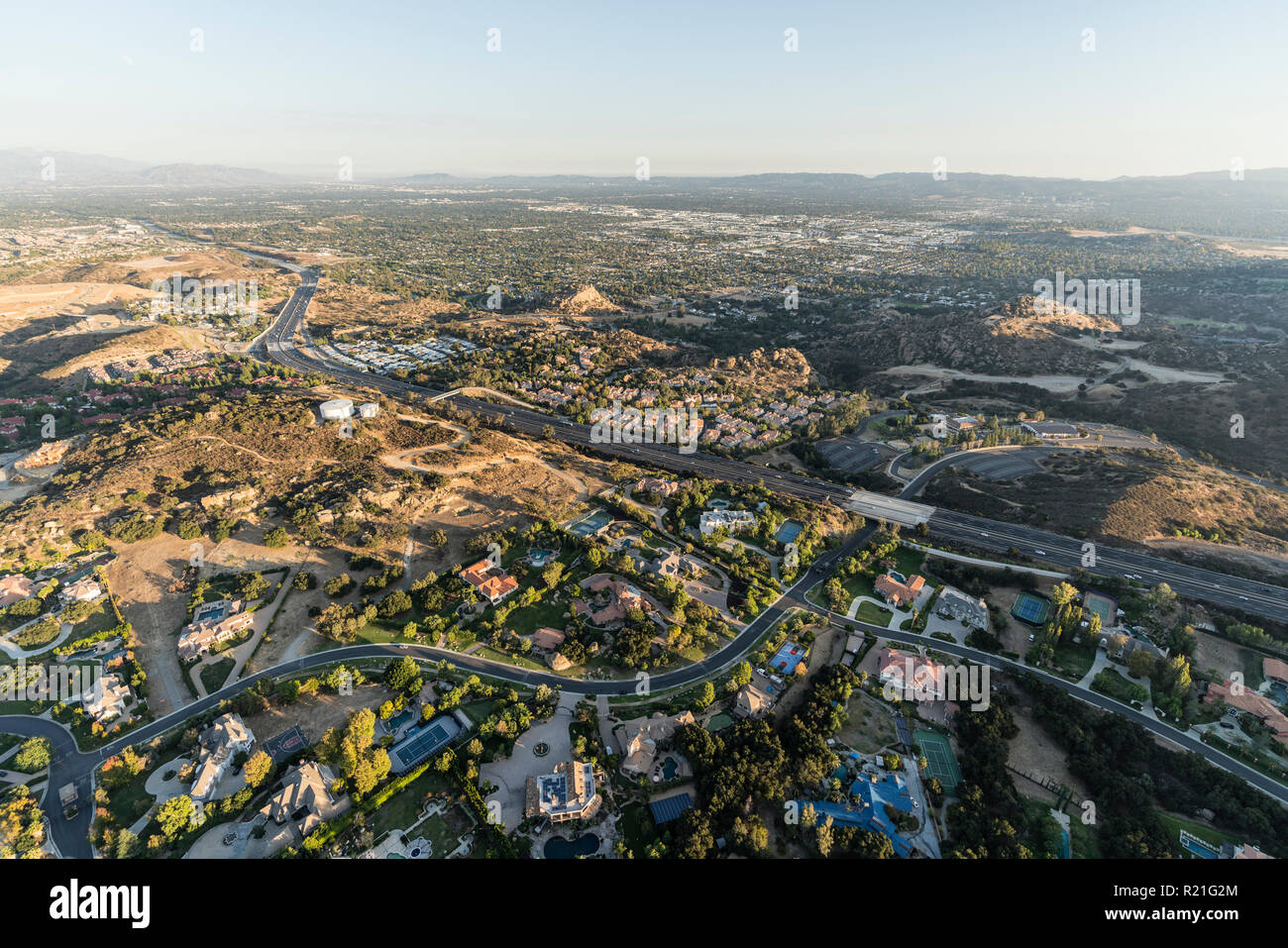 Late afternoon aerial view of mansions, condos along the 118 freeway in