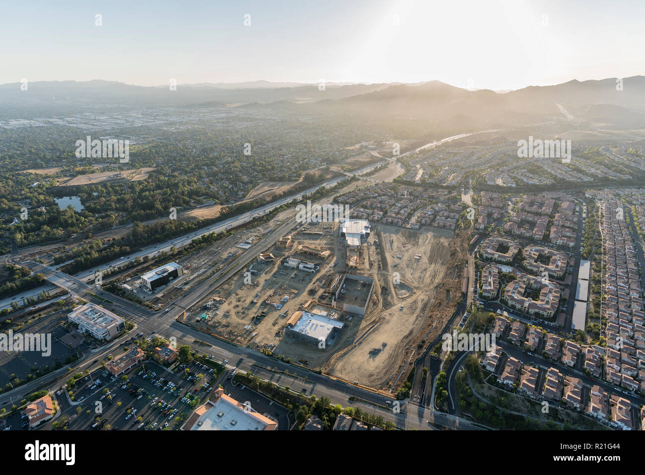 Aerial afternoon view of shopping center construction, Rinaldi Street and the 118 freeway in the Porter Ranch neighborhood of Los Angeles, California. Stock Photo