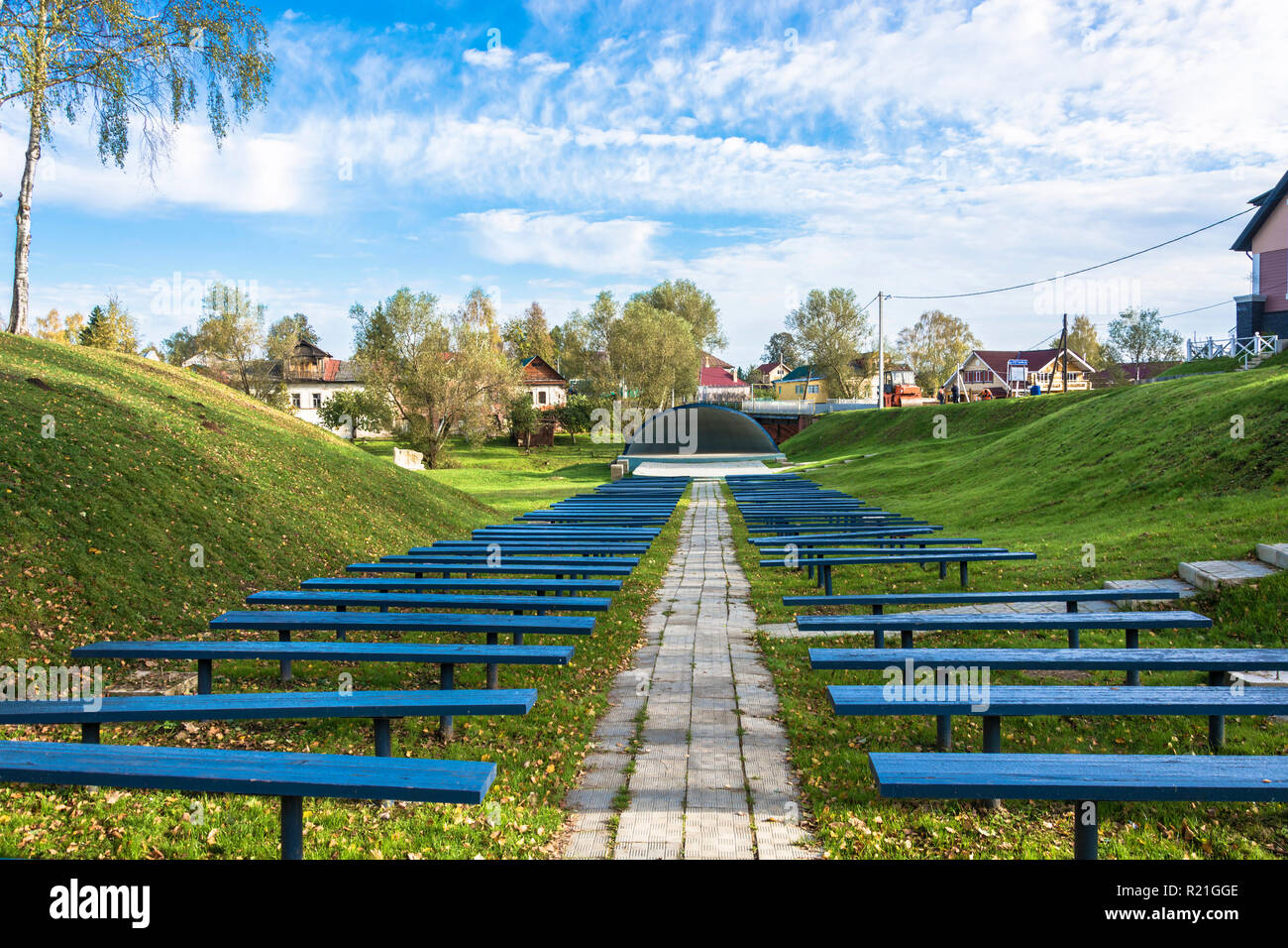 Vyatkoye Village, Yaroslavl Region, Russia - 10/02/2018: Pop platform with two rows of blue benches on October 2, 2018, Vyatkoye Village, Yaroslavl Re Stock Photo