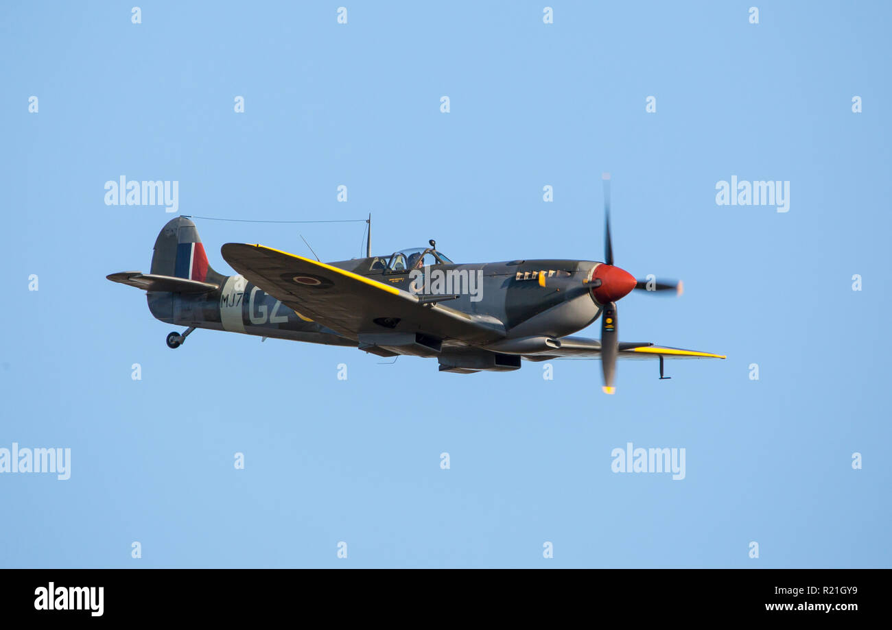 MONROE, NC (USA) - November 10, 2018:  A British Spitfire fighter aircraft in flight against a bright blue sky at the Warbirds Over Monroe Air Show. Stock Photo