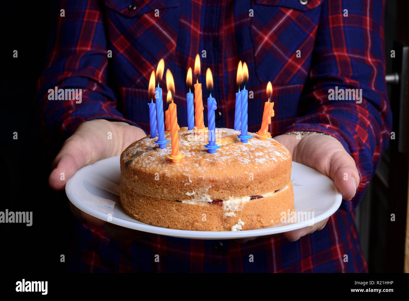 Birthday cake with lit candles Stock Photo - Alamy