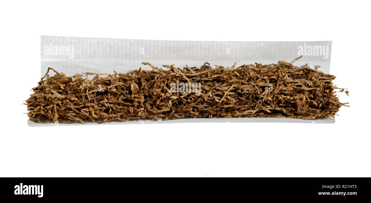 Rolling fine cut tobacco and roll paper for hand rolled cigarette Stock Photo