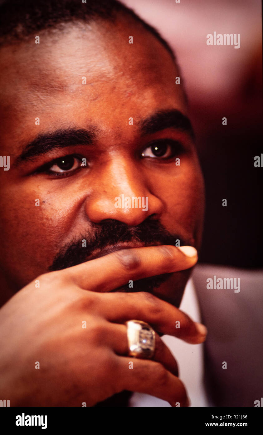 Evander Holyfield during a press conference in Atlanta in 1991 announcing his match against George Foreman. Holyfield is an American former professional boxer who competed from 1984 to 2011. He reigned as the undisputed champion at cruiserweight in the late 1980s and at heavyweight in the early 1990s, and remains the only boxer in history to win the undisputed championship in two weight classes. Nicknamed 'The Real Deal', Holyfield is the only four-time world heavyweight champion, having held the unified WBA, WBC and IBF titles from 1990 to 1992. Stock Photo
