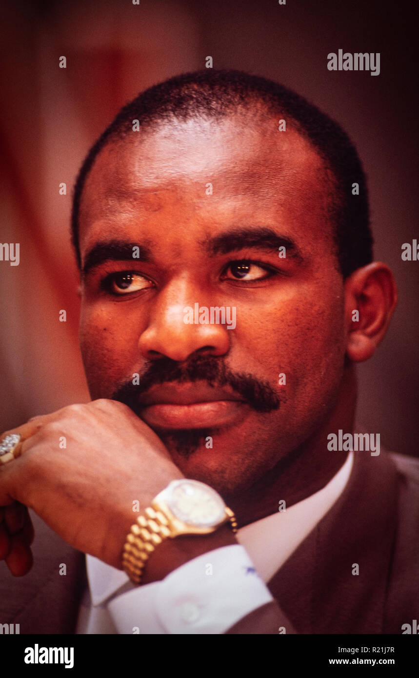 Evander Holyfield during a press conference in Atlanta in 1991 announcing his match against George Foreman. Holyfield is an American former professional boxer who competed from 1984 to 2011. He reigned as the undisputed champion at cruiserweight in the late 1980s and at heavyweight in the early 1990s, and remains the only boxer in history to win the undisputed championship in two weight classes. Nicknamed 'The Real Deal', Holyfield is the only four-time world heavyweight champion, having held the unified WBA, WBC and IBF titles from 1990 to 1992. Stock Photo