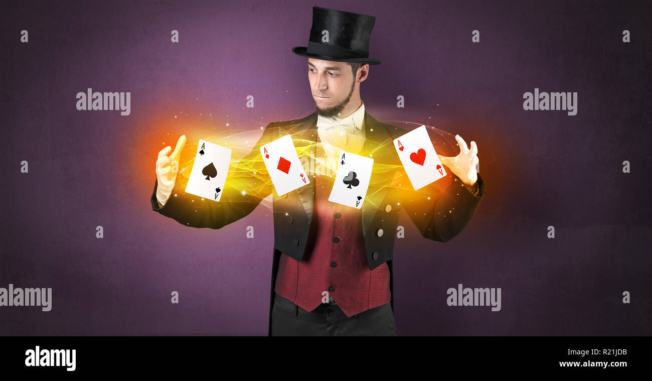 Illusionist in tails bandy play cards between his two hands Stock Photo ...