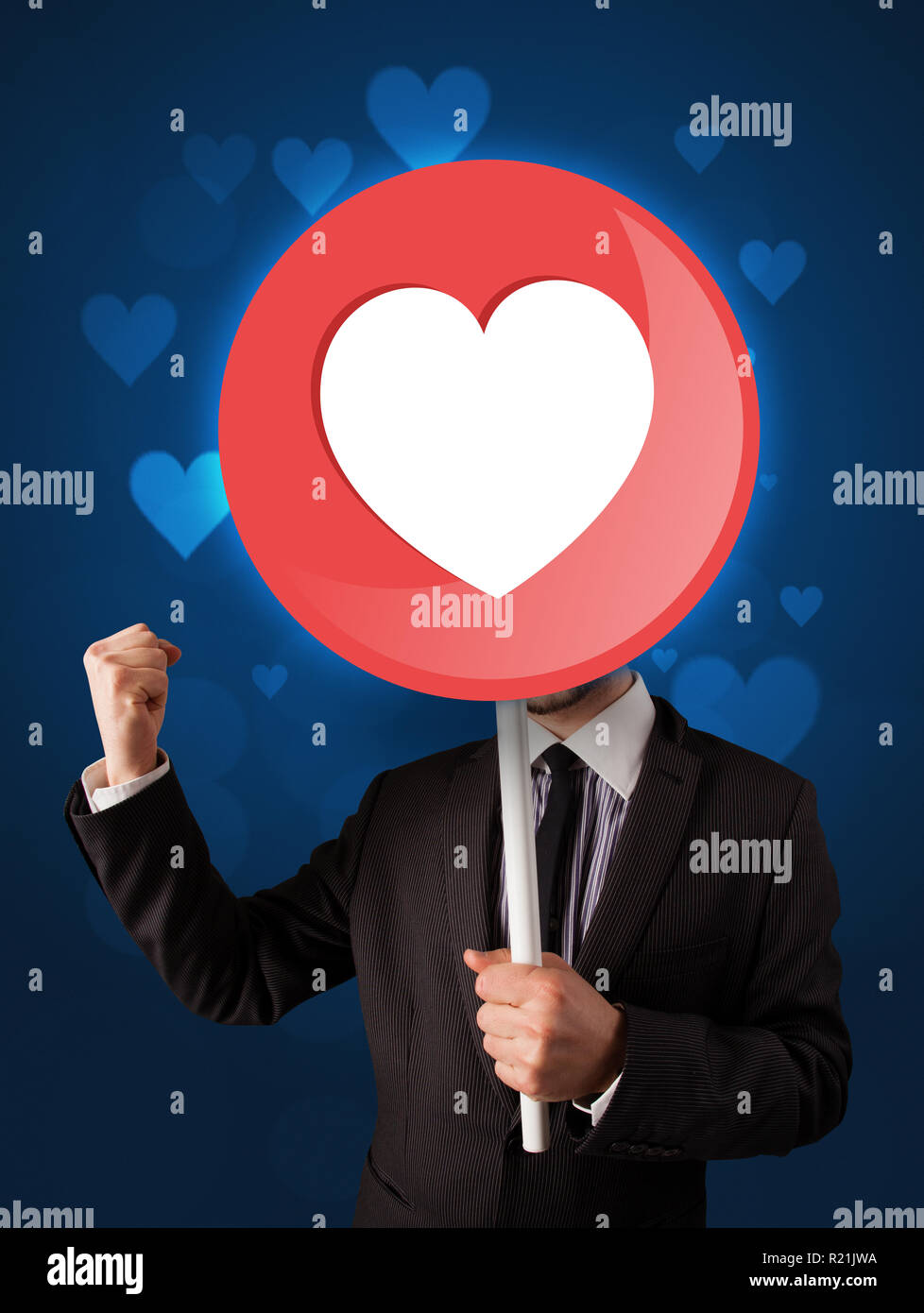 Smart businessman holding round sign with heart Stock Photo Alamy