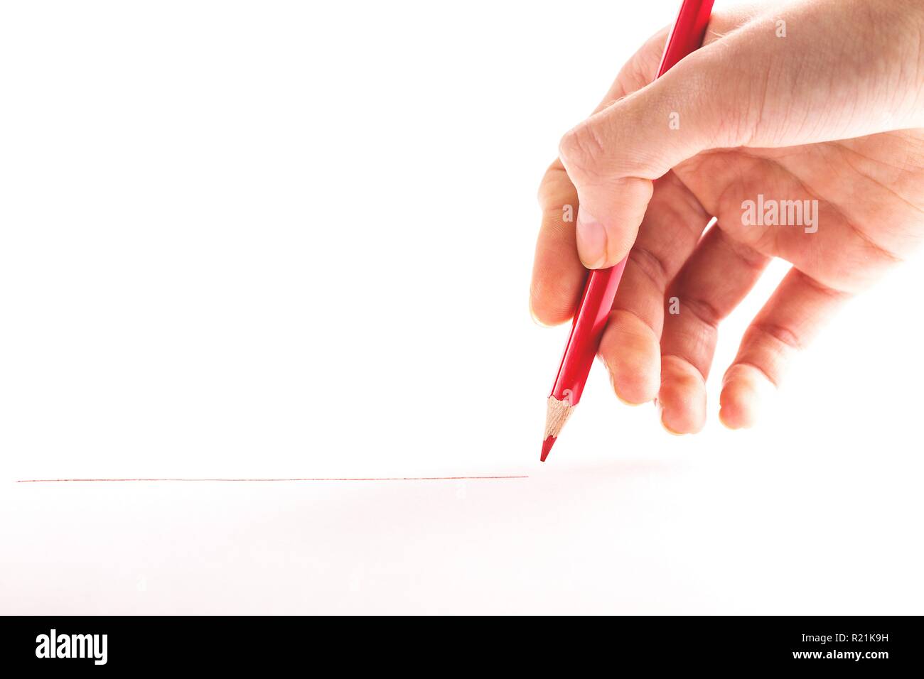 hand with the red pencil on a white background Stock Photo - Alamy