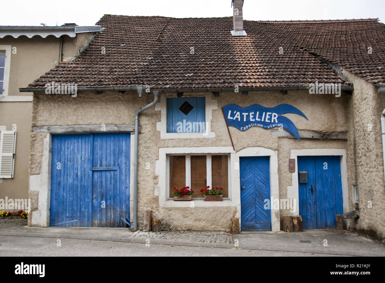 Colorful blue doors on a craftsman's workshop near the birthplace of Joan of Arc in Domremy-la- Pucelle, France. Stock Photo