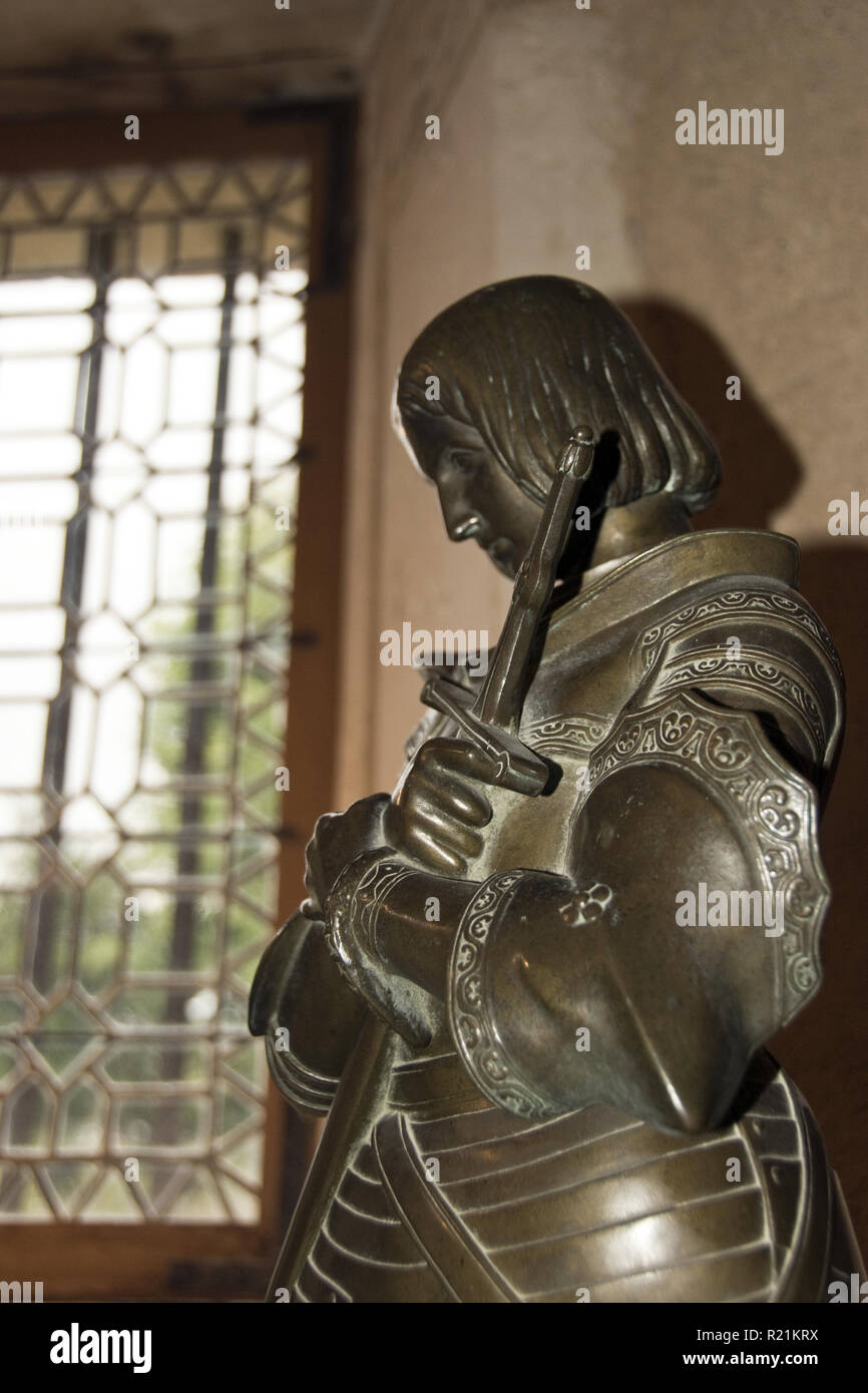 A bronze statue of Joan of Arc stands in the main room at her birthplace at Domremy-la- Pucelle, France. Stock Photo