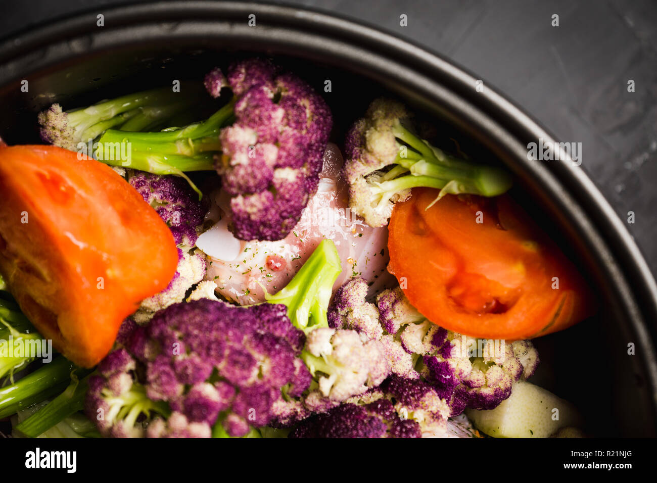 Vegetables and chicken in bowl ready for stewing. Shallow depth of ...
